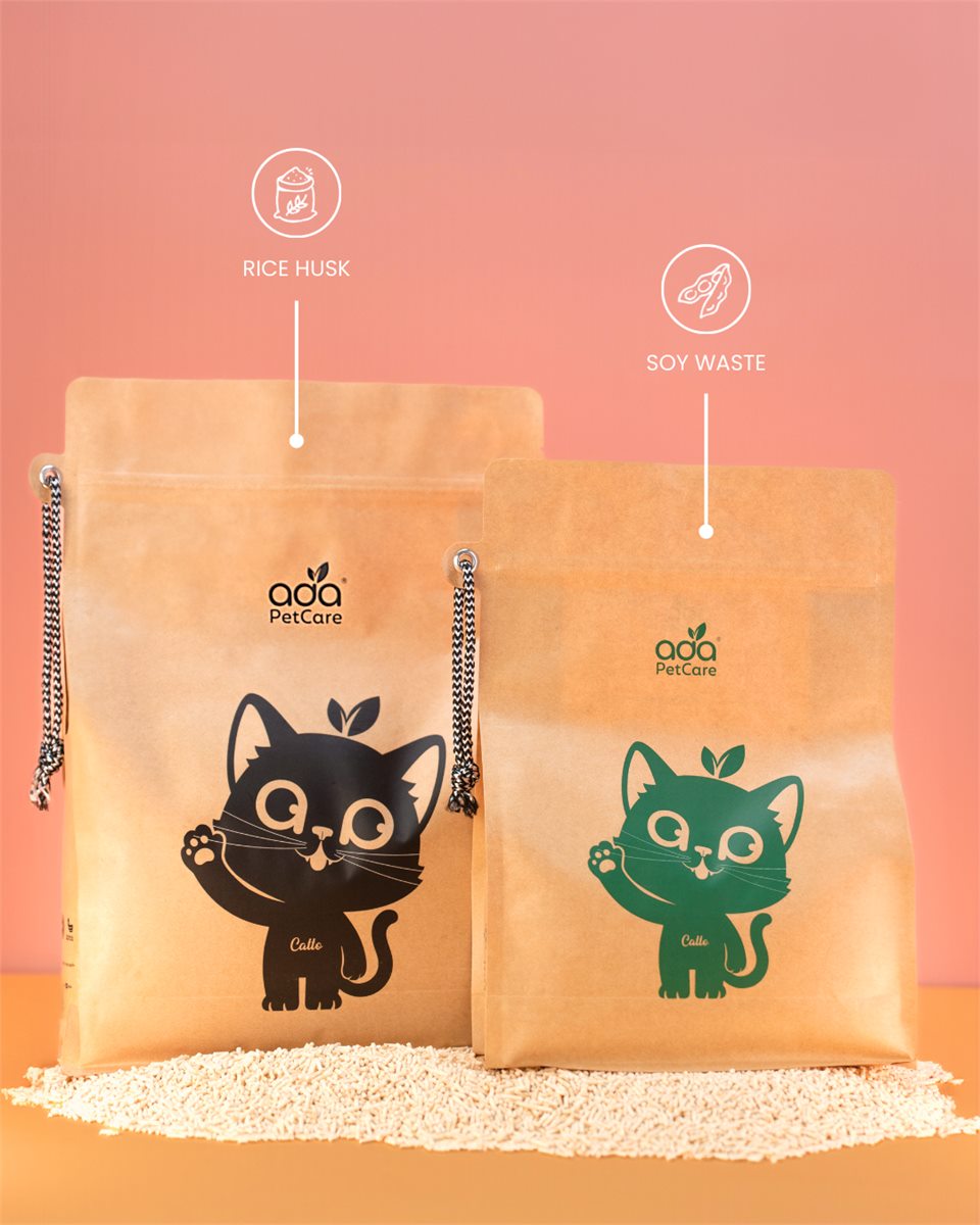 Two ADA Pet Care cat litter packs on a bed of tofu litter, labelled plant based starch and soy waste, with a cat looking on